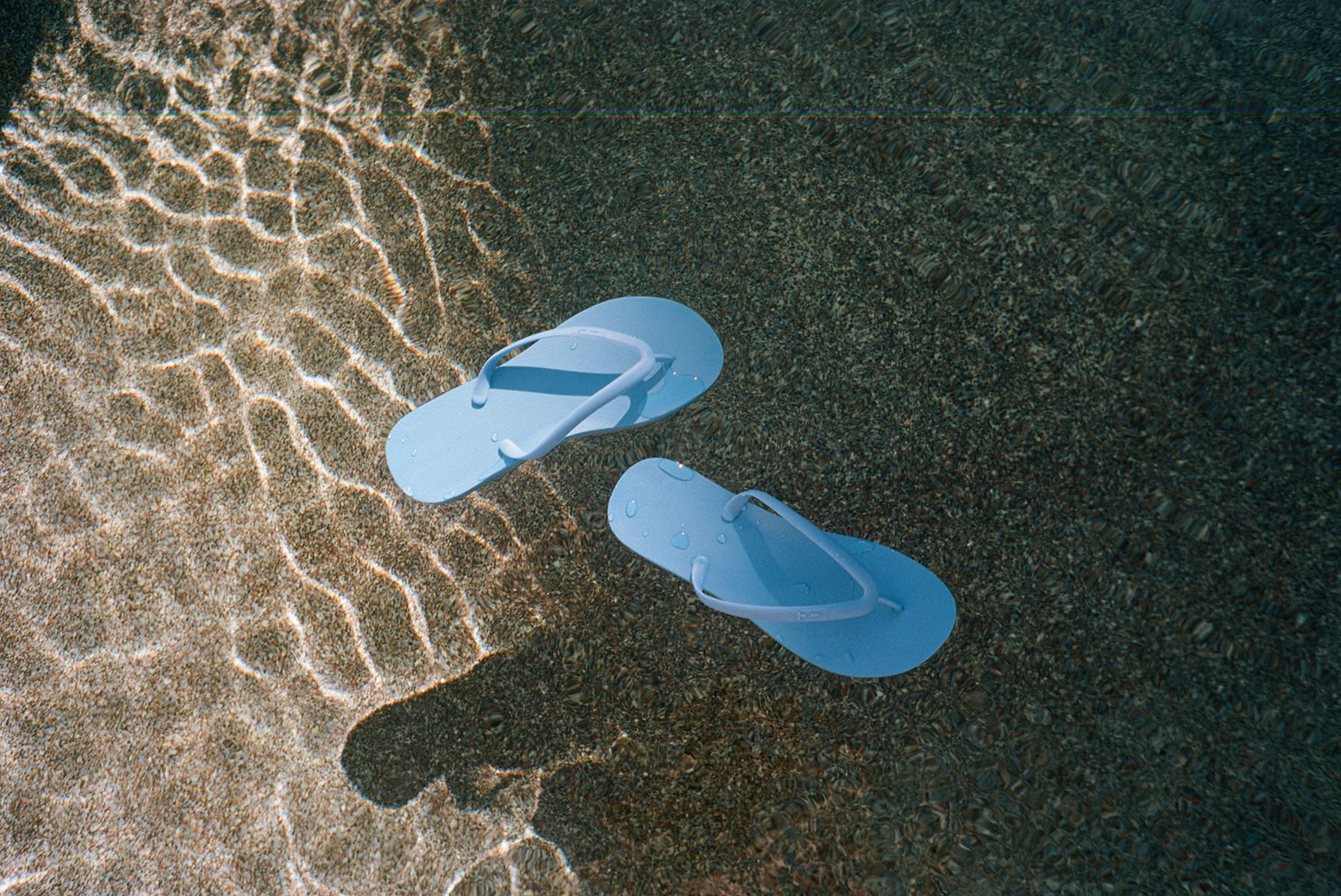 Tidal-blue-flops-water